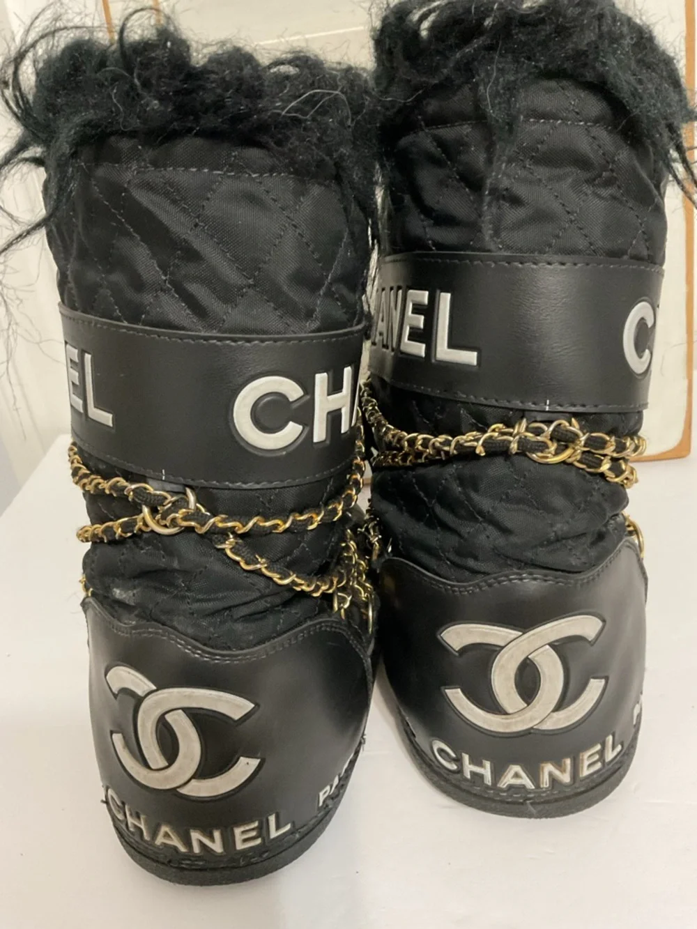 CHANEL Black and Gold Quilted Winter Lace-Up Boots